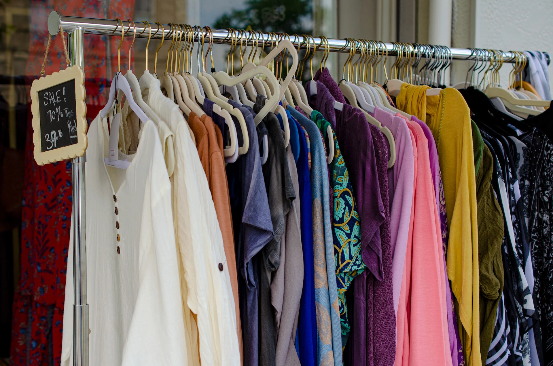 rack of vintage clothes on sale