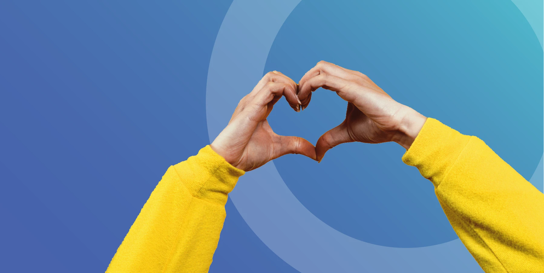 blue background with hands making a heart wearing yellow jumper